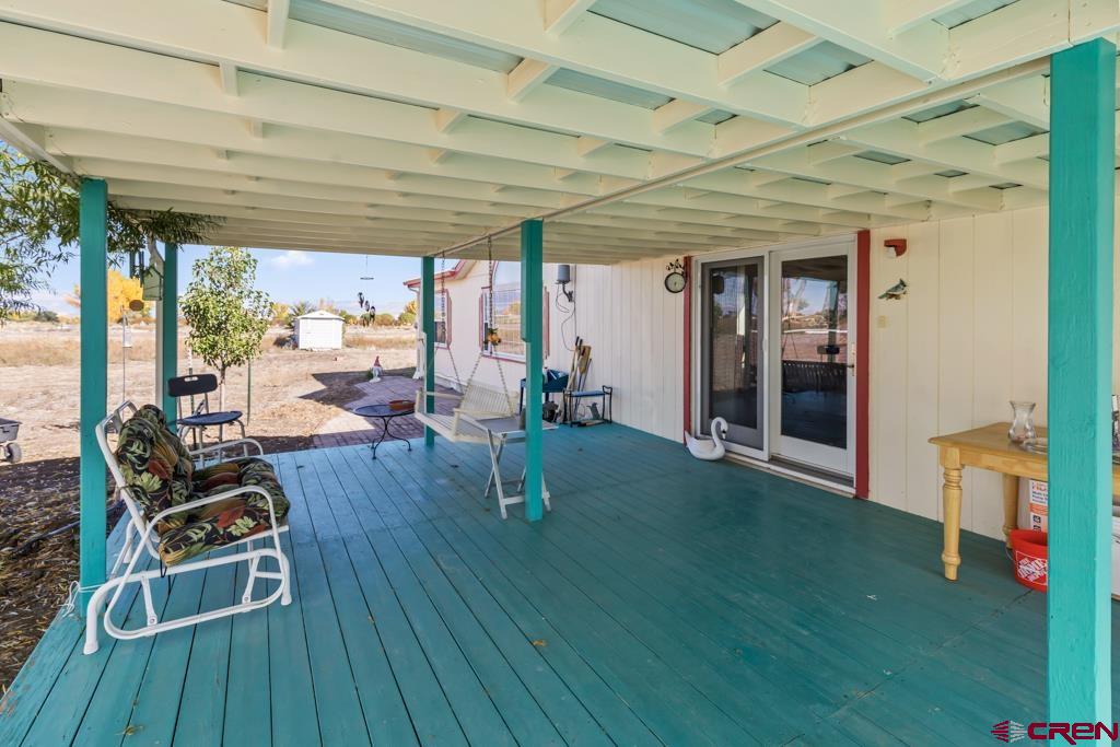 7655 6075th Road Olathe, CO 81425 - Photo 24 of 24 a living room with patio furniture