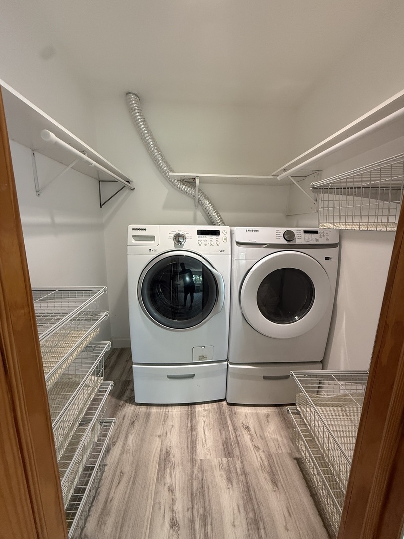 728 Dempster Street, Unit 210 Mount Prospect, IL 60056 - Photo 14 of 27 a view of walk in closet with clothes and shoes