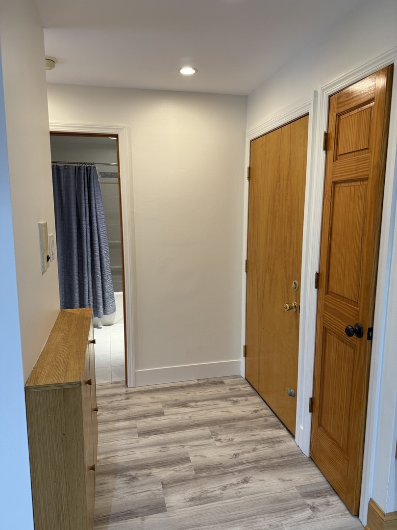 728 Dempster Street, Unit 210 Mount Prospect, IL 60056 - Photo 19 of 27 wooden floor in an empty room