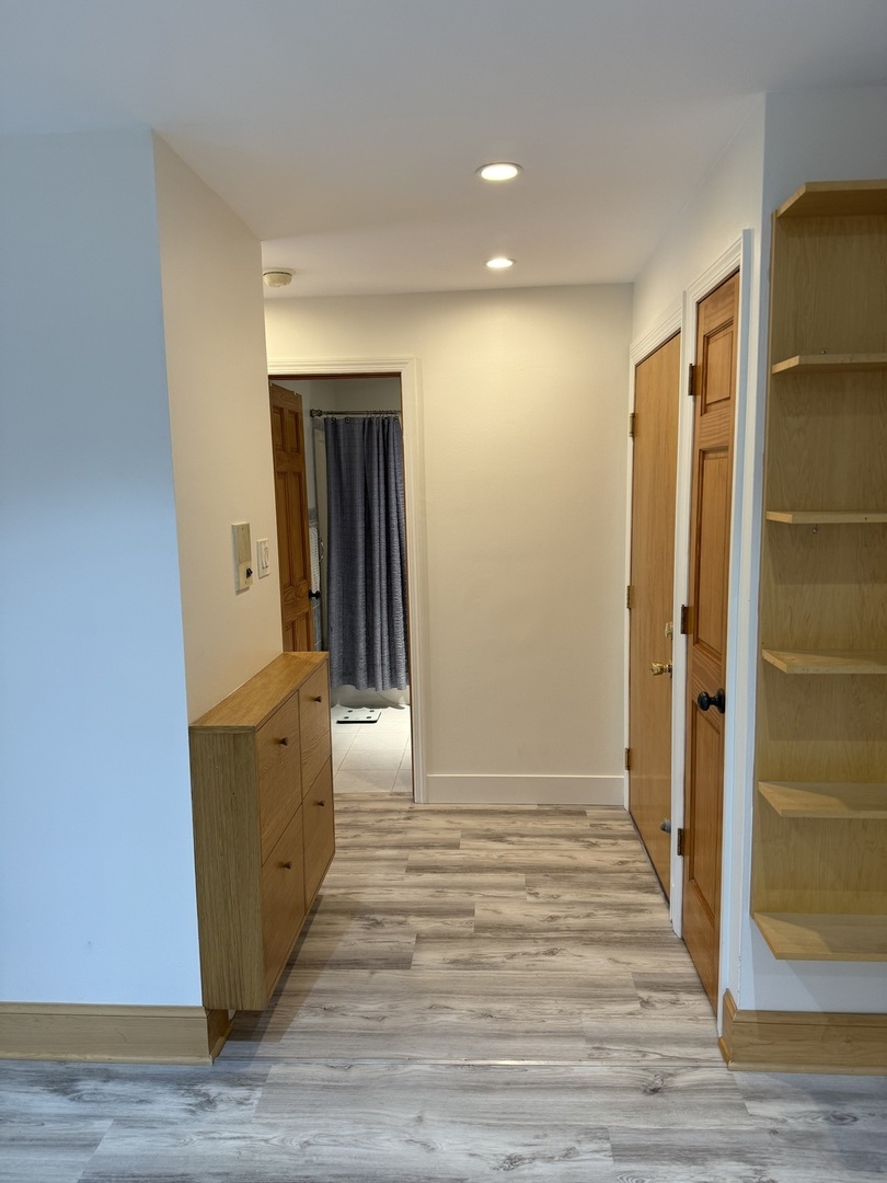 728 Dempster Street, Unit 210 Mount Prospect, IL 60056 - Photo 20 of 27 a view of hallway with wooden floor