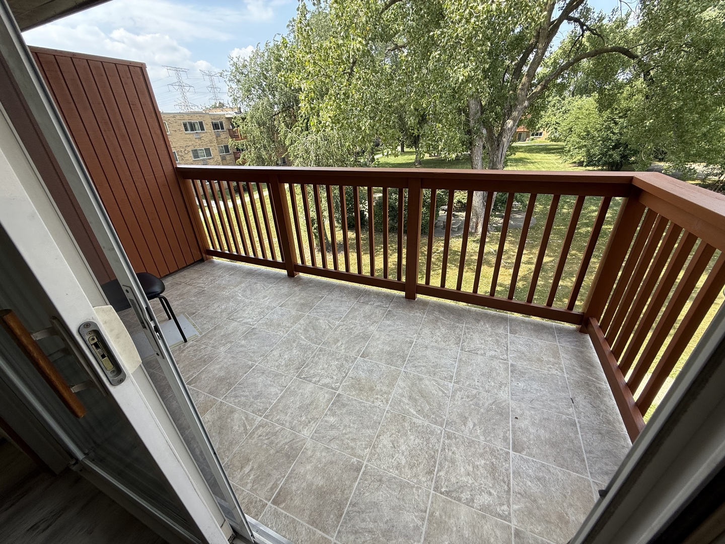 728 Dempster Street, Unit 210 Mount Prospect, IL 60056 - Photo 24 of 27 a view of balcony with wooden floor