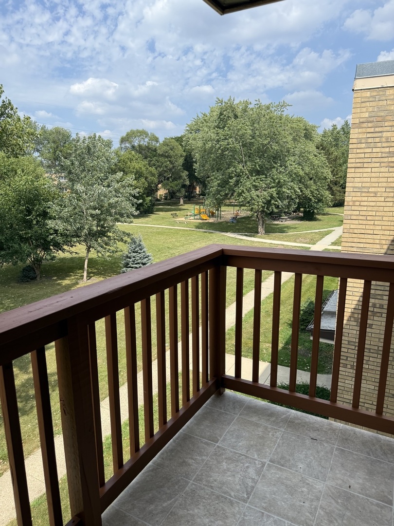 728 Dempster Street, Unit 210 Mount Prospect, IL 60056 - Photo 25 of 27 a view of a balcony with an outdoor space