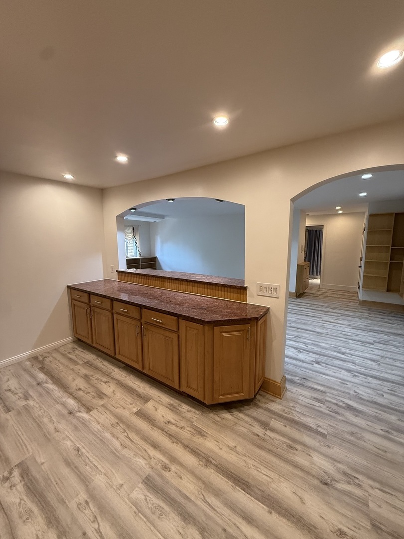 728 Dempster Street, Unit 210 Mount Prospect, IL 60056 - Photo 5 of 27 a living room with furniture and a wooden floor