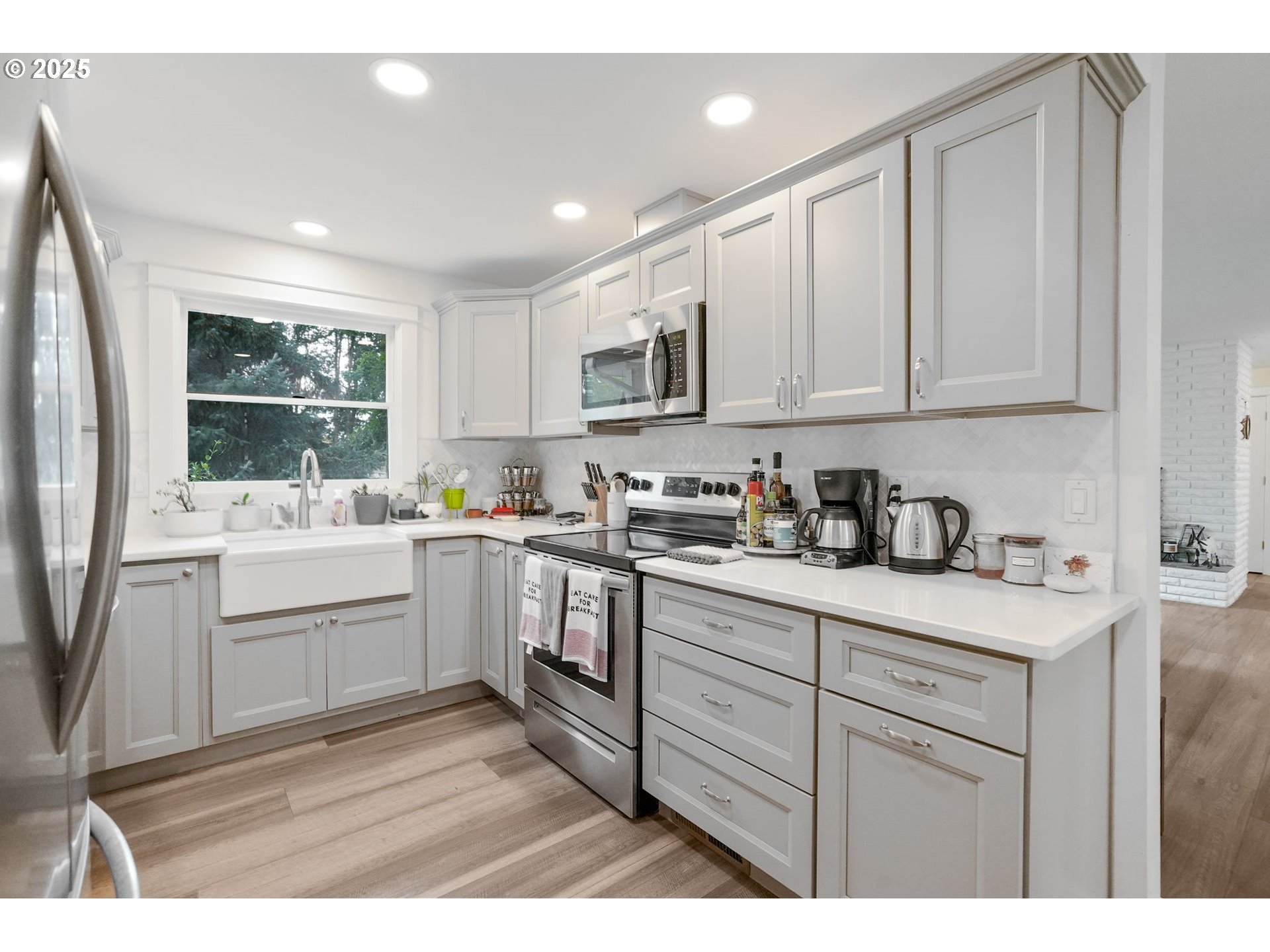 1780 Clover Ridge Road Northeast Albany, OR 97322 - Photo 18 of 45 a kitchen with white cabinets and white appliances