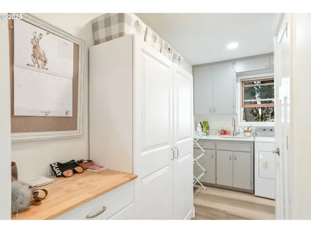 a bathroom with a sink mirror and window