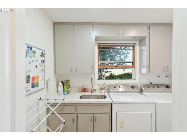 a living room with lots of furniture and a large window