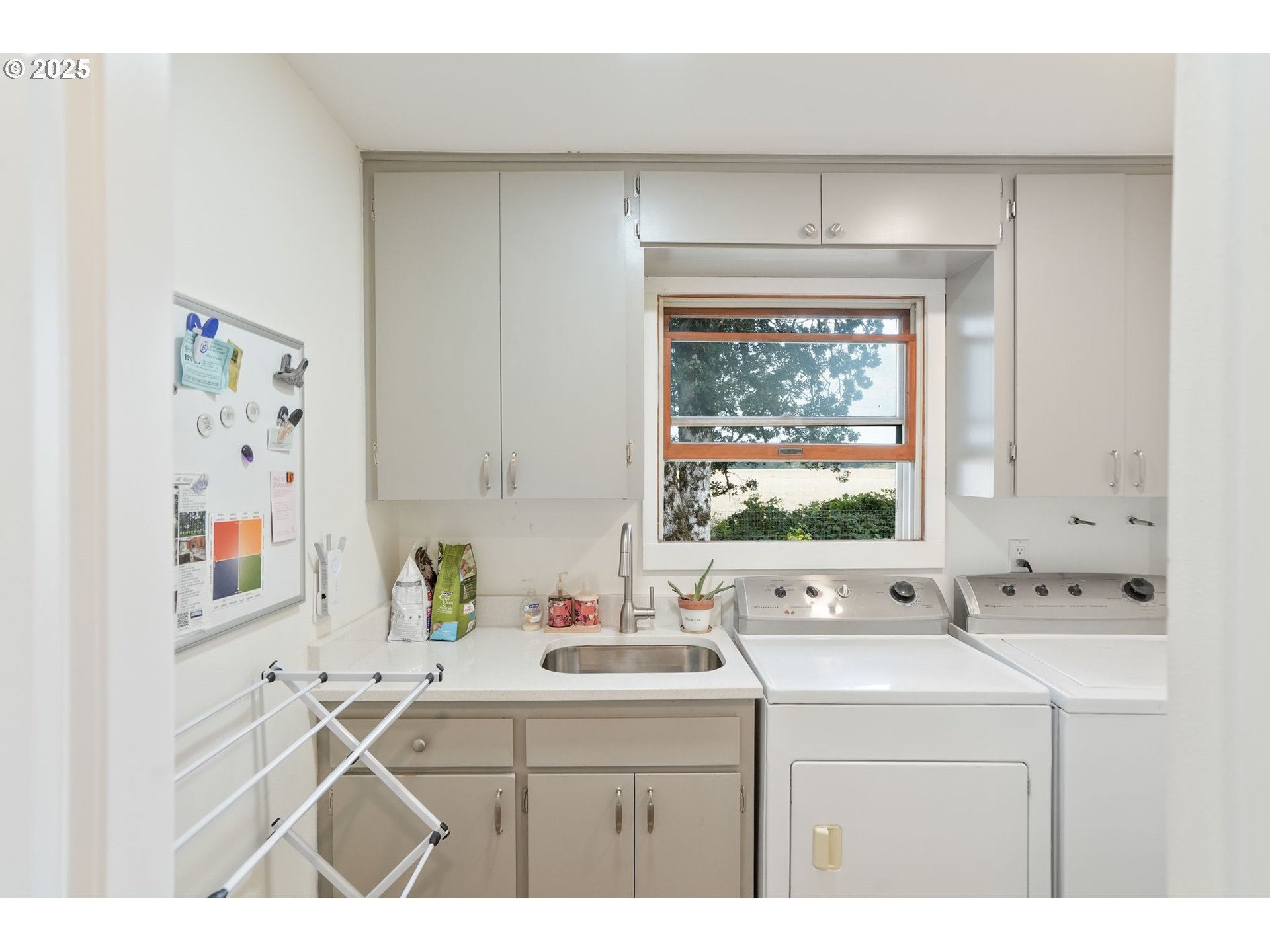 1780 Clover Ridge Road Northeast Albany, OR 97322 - Photo 20 of 45 a bathroom with a sink mirror and window