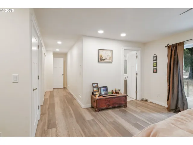 a bathroom with a sink mirror and a bath tub