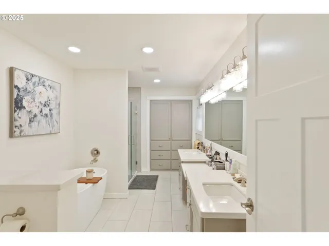 a bathroom with a sink double vanity and a mirror