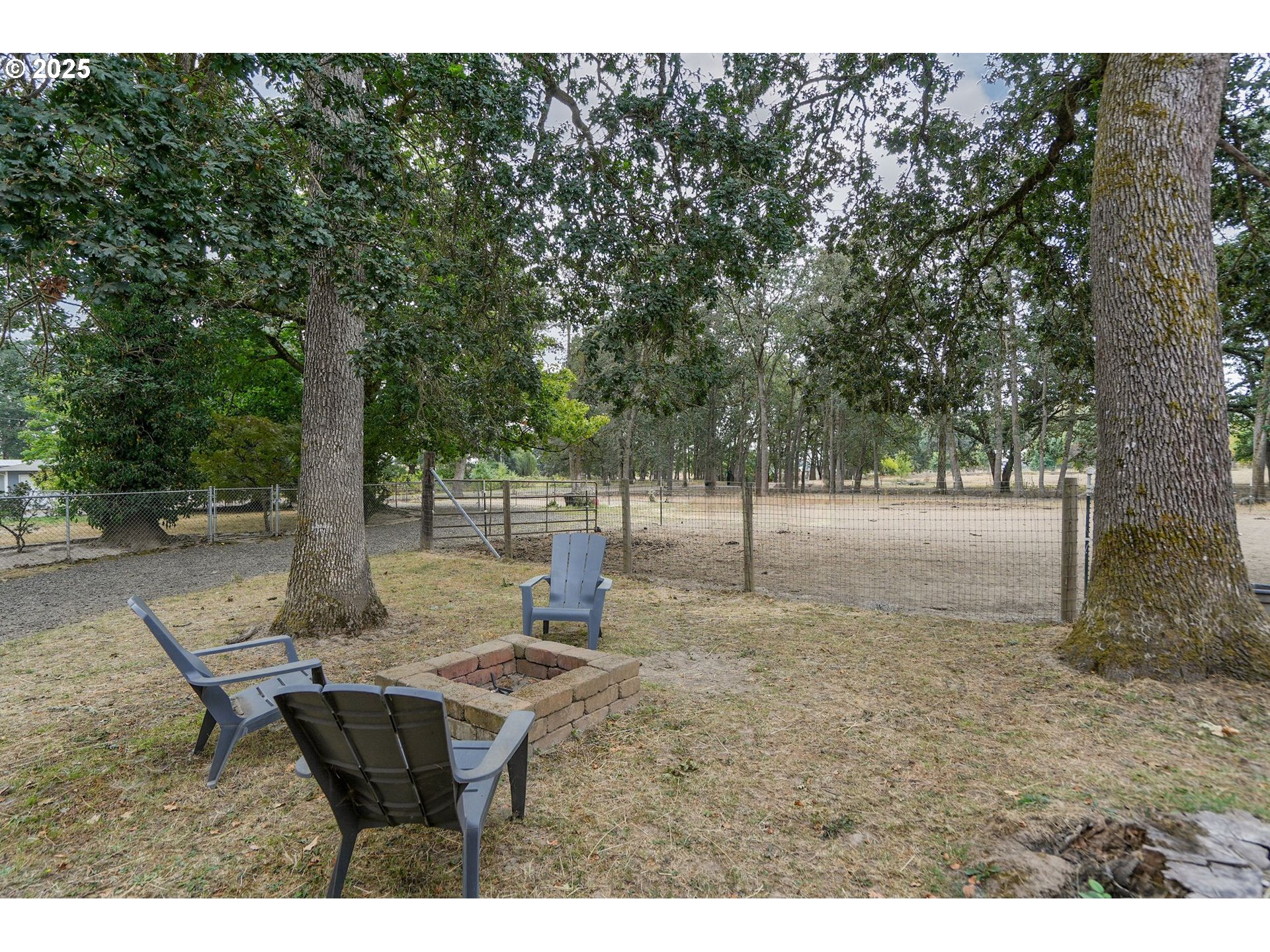 1780 Clover Ridge Road Northeast Albany, OR 97322 - Photo 32 of 45 a backyard of a house with table and chairs