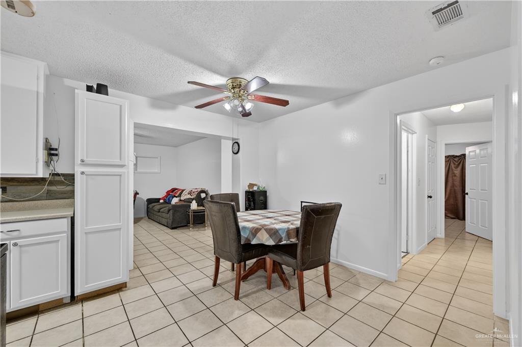 616 5th Street Weslaco, TX 78596 - Photo 20 of 33 a view of a dining room and chairs