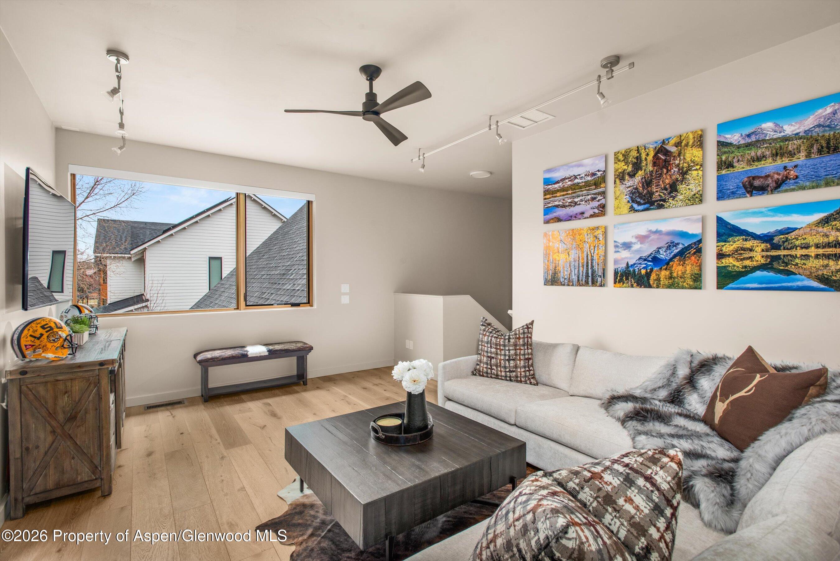 129 Valley Court Basalt, CO 81621 - Photo 19 of 26 a living room with furniture and wooden floor