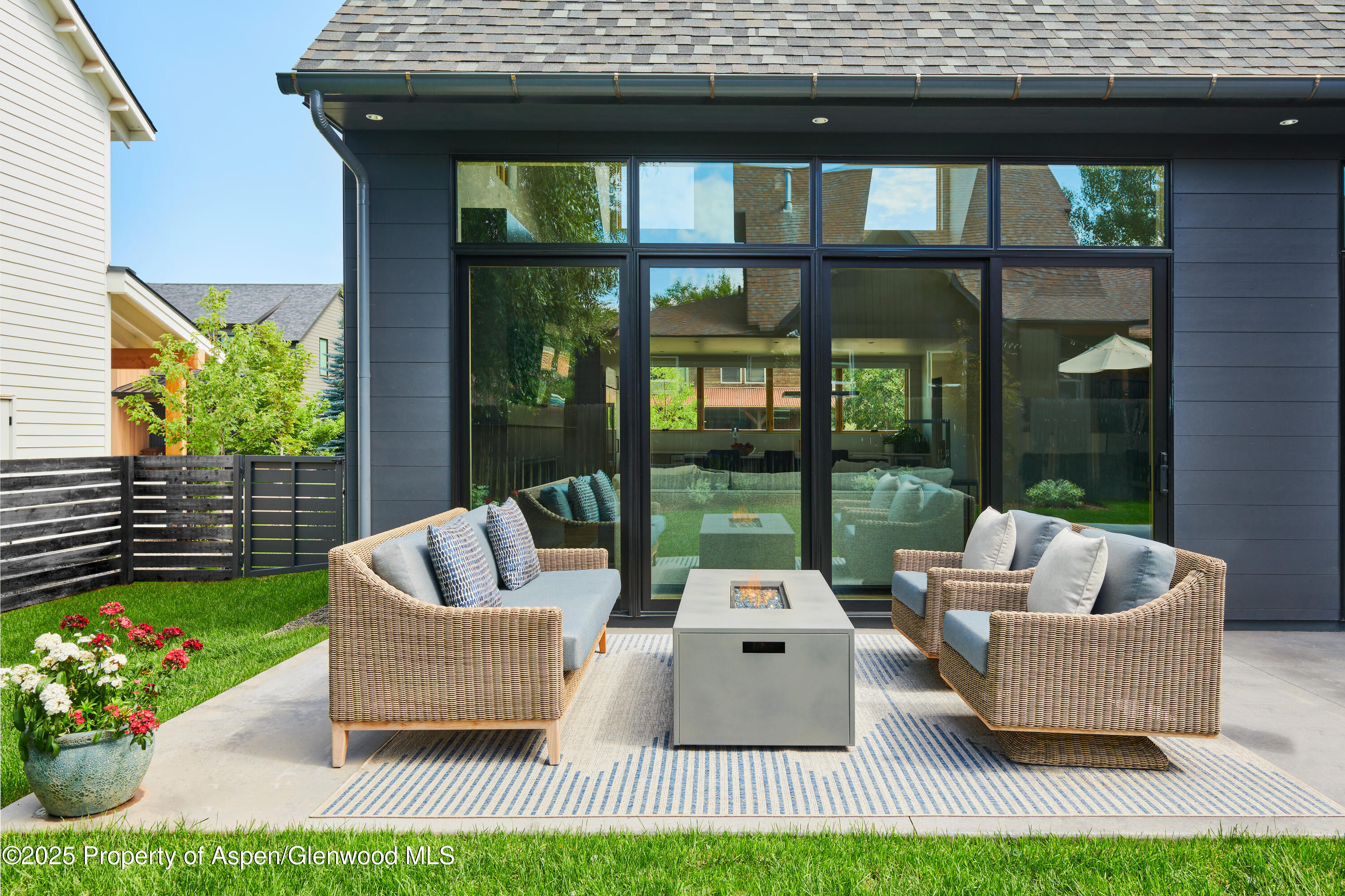 129 Valley Court Basalt, CO 81621 - Photo 2 of 26 a living room with patio furniture and a garden
