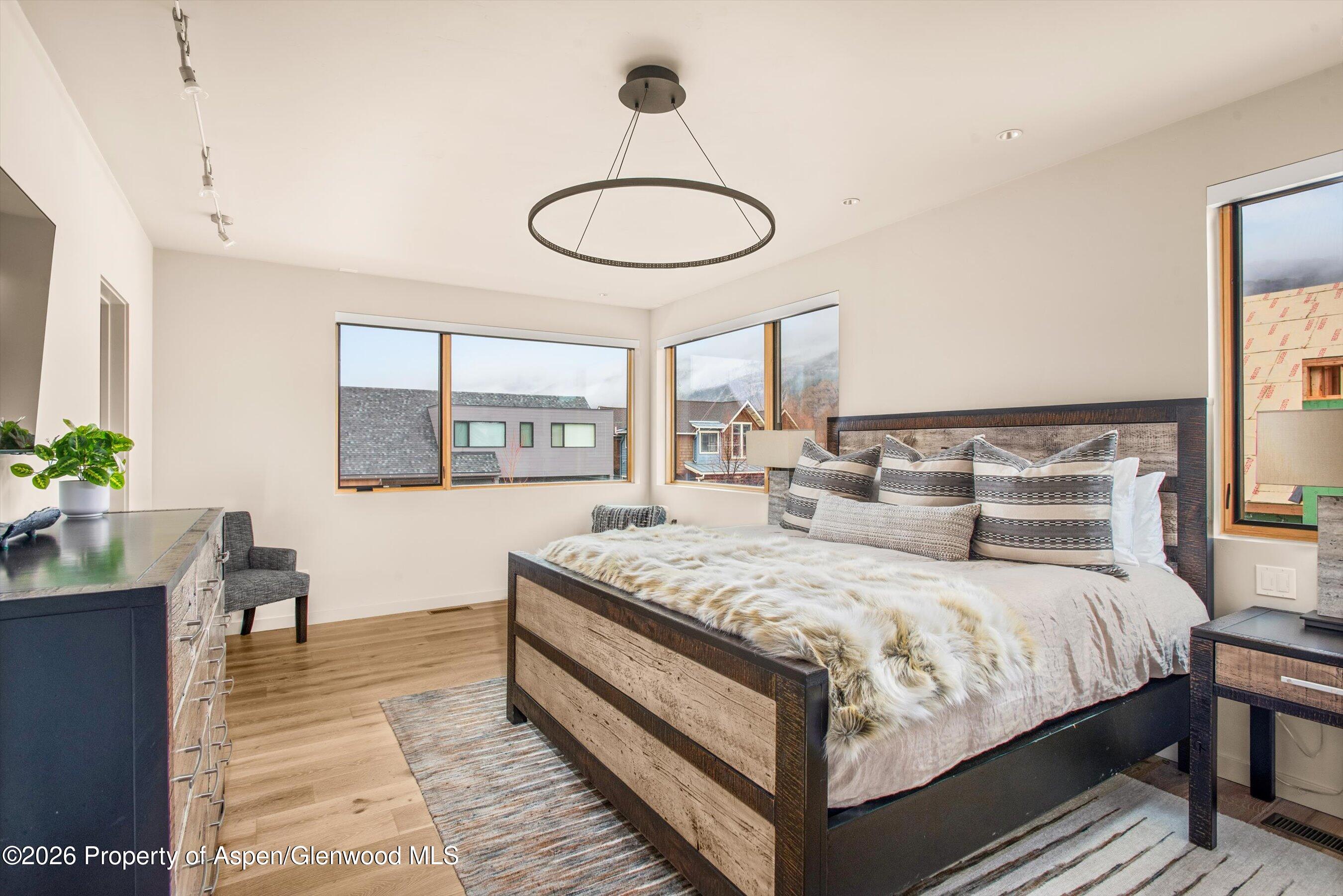 129 Valley Court Basalt, CO 81621 - Photo 21 of 26 a bedroom with a bed and a window