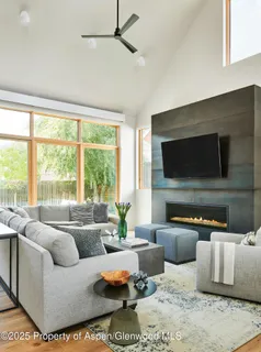 a living room with furniture and a flat screen tv