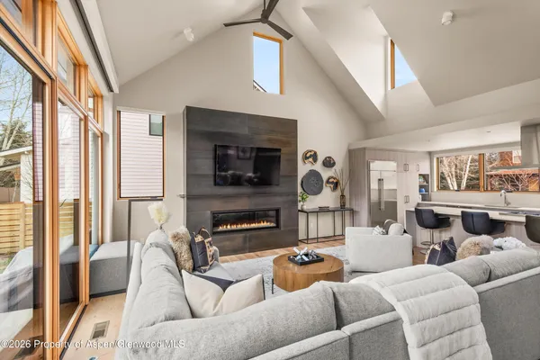 a living room with furniture and a flat screen tv