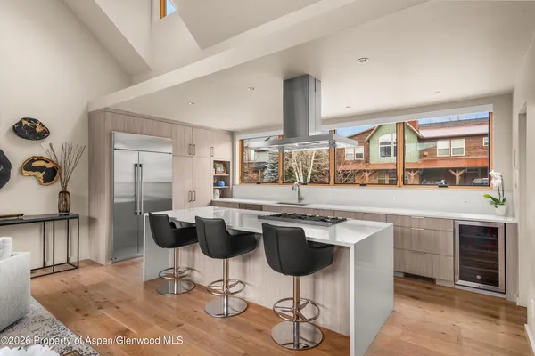a kitchen with a table and chairs in it