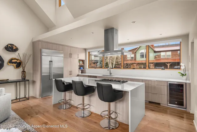 a kitchen with a table and chairs in it