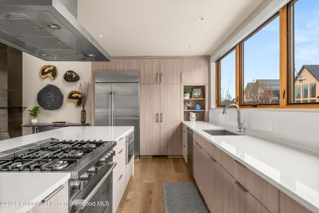 a kitchen with a stove and a sink