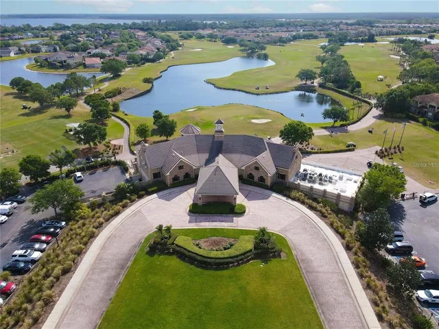 an aerial view of residential houses with outdoor space and swimming pool