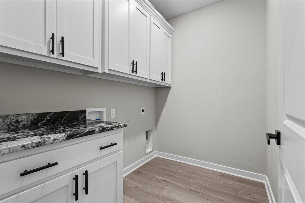 3632 County Road Blossom, TX 75416 - Photo 14 of 36 a kitchen with granite countertop a sink and cabinets
