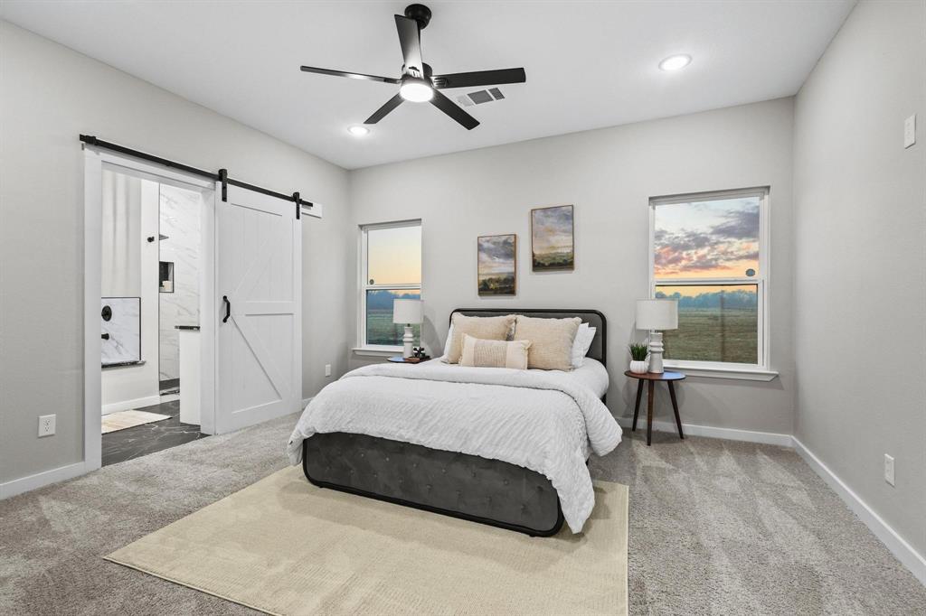 3632 County Road Blossom, TX 75416 - Photo 15 of 36 a bedroom with a large bed and a window