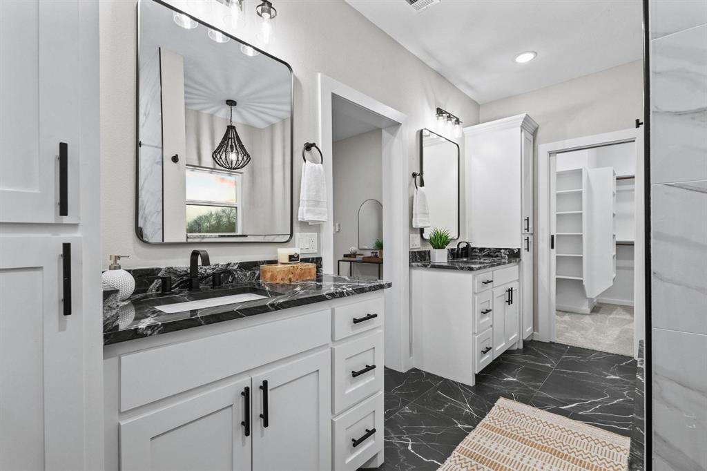3632 County Road Blossom, TX 75416 - Photo 19 of 36 a bathroom with a double vanity sink mirror and double