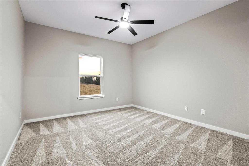 3632 County Road Blossom, TX 75416 - Photo 24 of 36 a view of room with window and ceiling fan