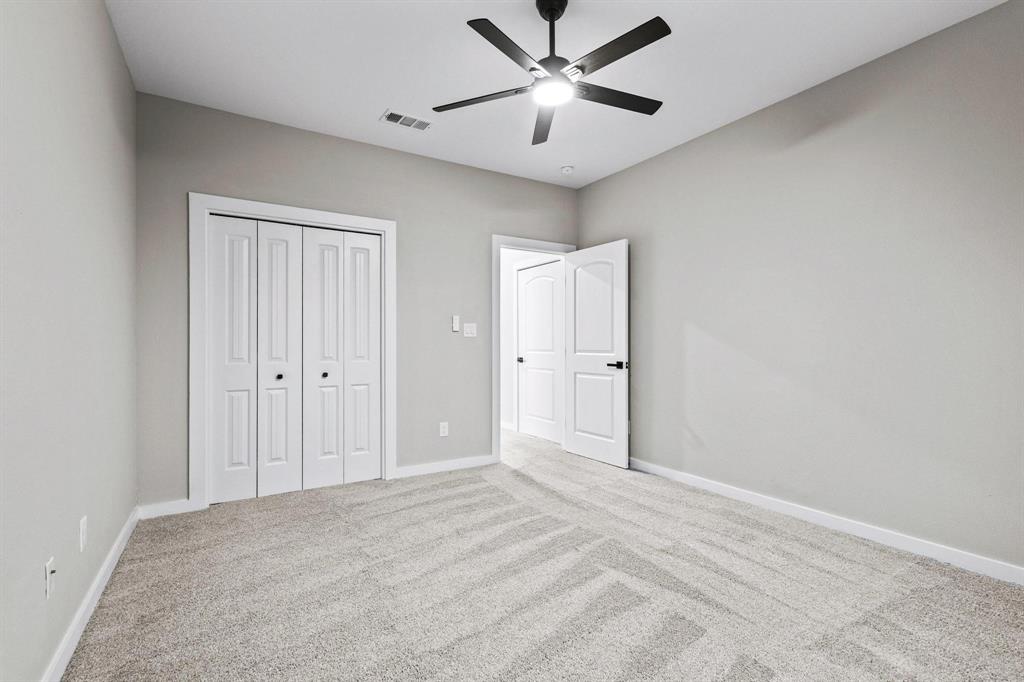 3632 County Road Blossom, TX 75416 - Photo 25 of 36 a view of a big room with closet and fan