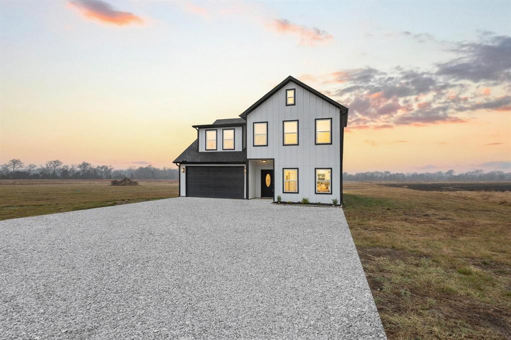 3632 County Road Blossom, TX 75416 - Photo 36 of 36 a view of a house next to a lake with mountain view