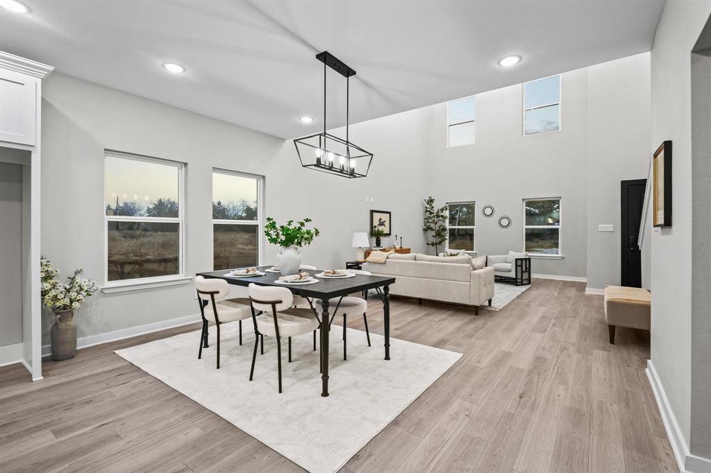 3632 County Road Blossom, TX 75416 - Photo 7 of 36 a view of a dining room with furniture window and wooden floor