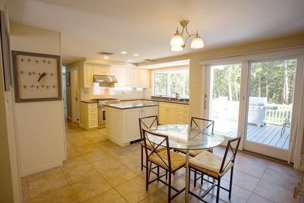 61 3 Ponds Road Wayland, MA 01778 - Photo 5 of 33 a dining room top with furniture and a large window