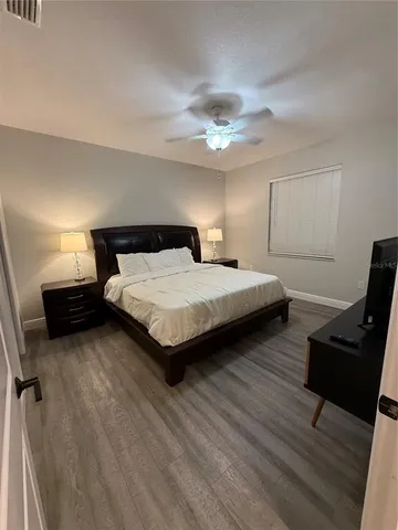 a bedroom with bed and window