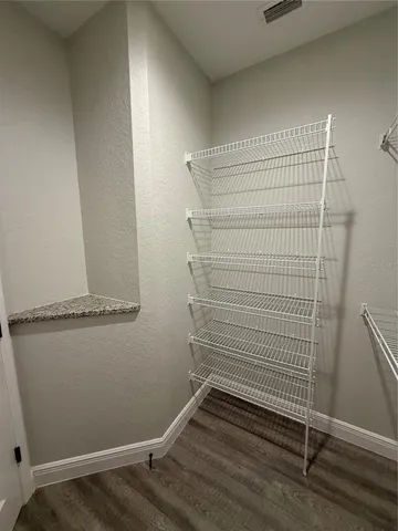 a view of small space with racks on the wall