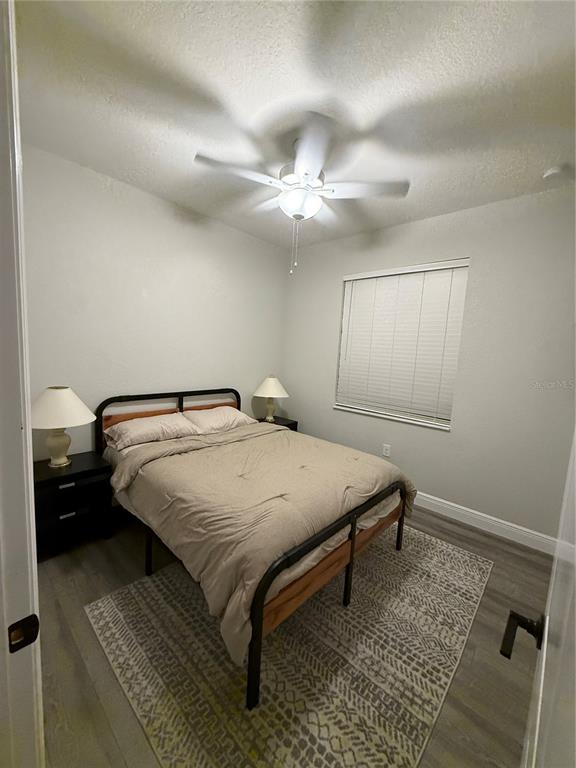 26267 Explorer Road Punta Gorda, FL 33983 - Photo 2 of 27 a bedroom with a bed and a chandelier