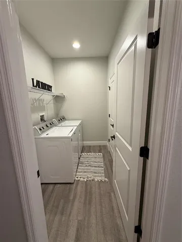 a bathroom with a sink a toilet a mirror and shower