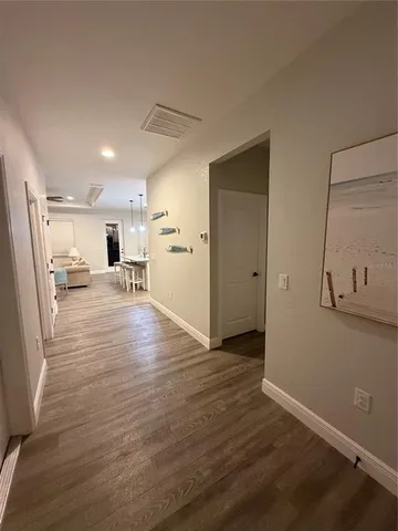 a view of a livingroom with wooden floor