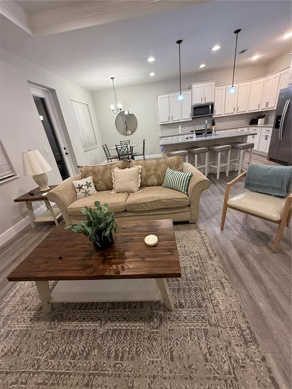 26267 Explorer Road Punta Gorda, FL 33983 - Photo 8 of 27 a living room with furniture and kitchen view