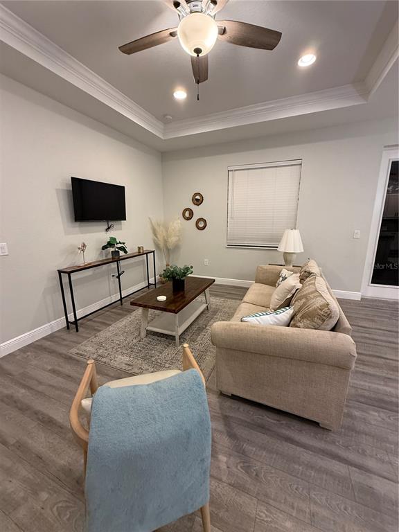 26267 Explorer Road Punta Gorda, FL 33983 - Photo 9 of 27 a living room with furniture and a flat screen tv