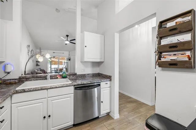 a kitchen with a sink and cabinets
