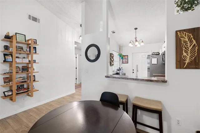 a bedroom with a bed and a chair in it