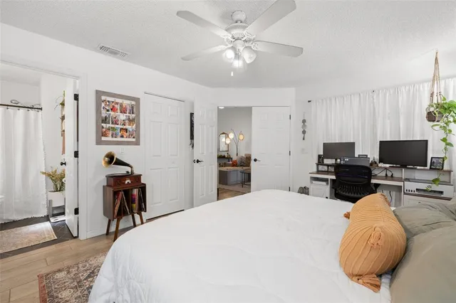 a bed room with a bed and a television