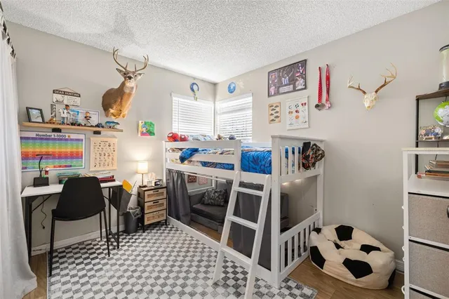 a room with furniture a rug and a window