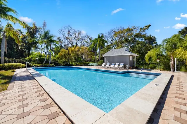 a view of swimming pool with a yard