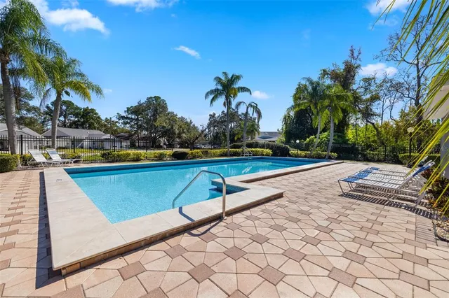 a view of swimming pool with chairs