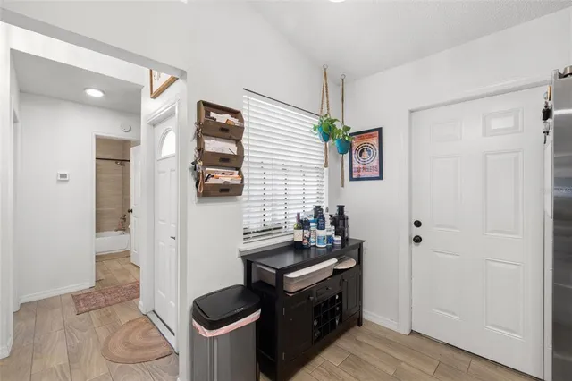 a kitchen with stainless steel appliances granite countertop a stove and a refrigerator