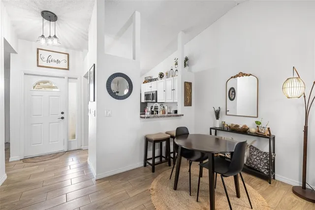 a view of a dining area with furniture and wooden floor