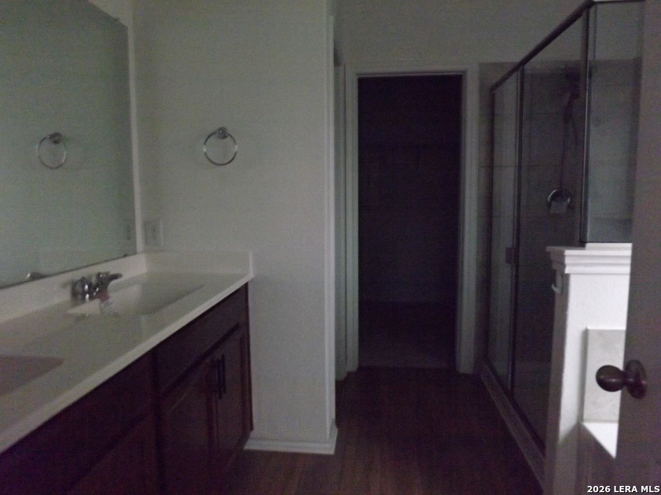 6835 Alaskan Wy. Converse, TX 78109 - Photo 19 of 22 a bathroom with a sink and mirror