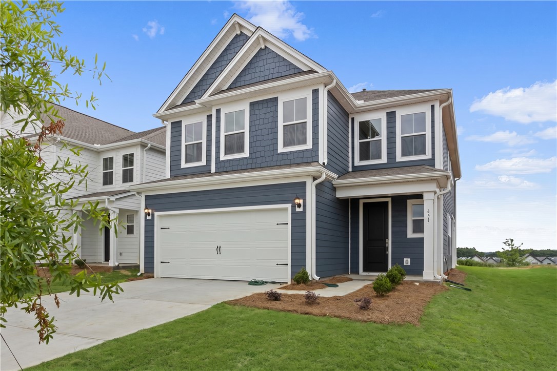 631 Sweetspire Trail, Unit 148 Seneca, SC 29678 - Photo 2 of 36 A handsome two-story residence with a classic gabled roofline and an attached garage.