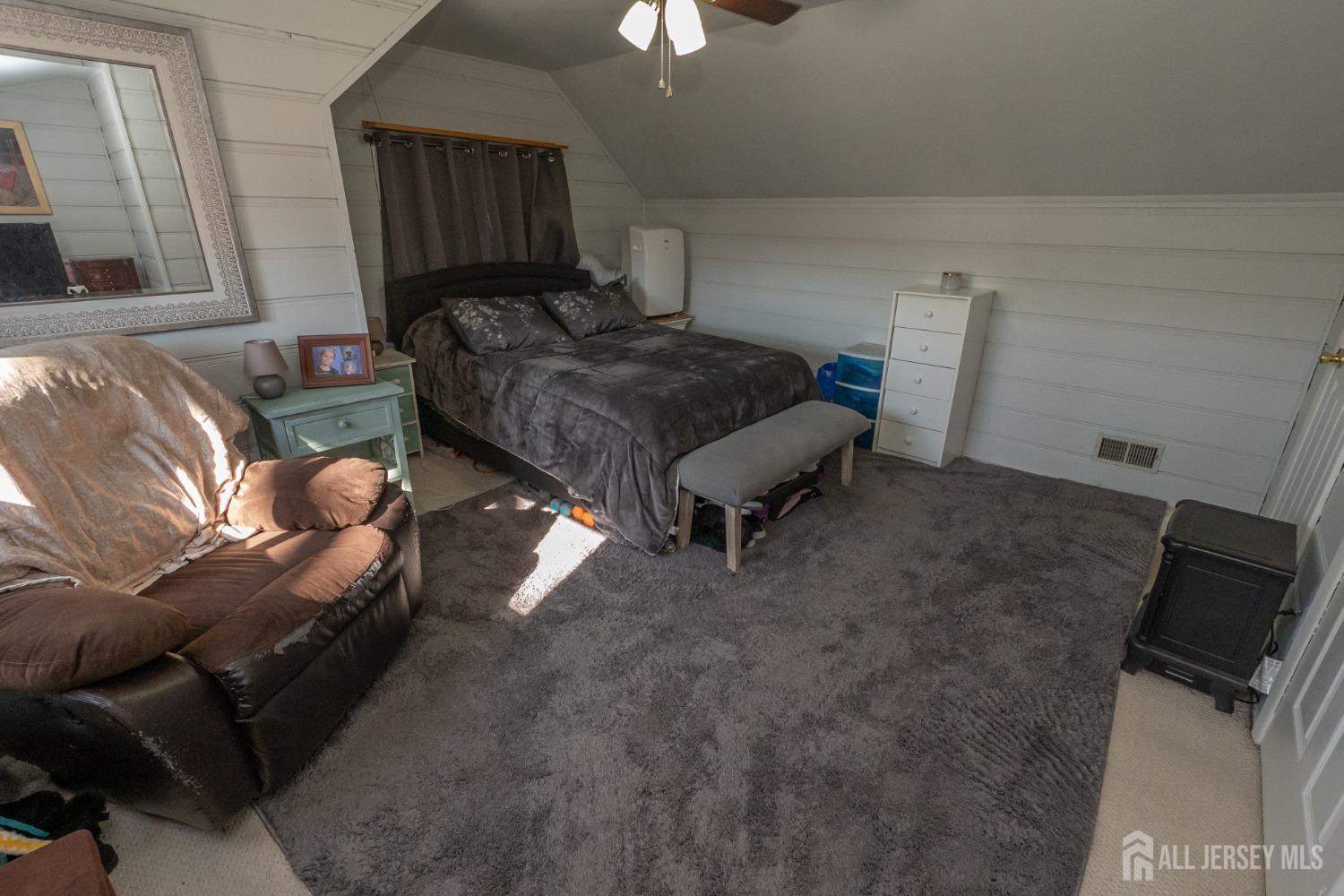 258 Sunset Avenue Old Bridge, NJ 08857 - Photo 11 of 27 a living room with furniture and a flat screen tv